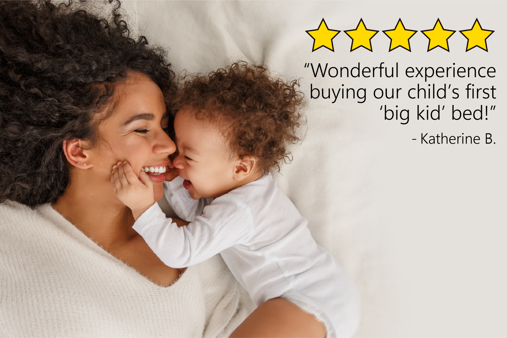 A picture of a mom and her baby sleeping in bed together, with a quote from a customer's 5-star review, stating "we had a wonderful experience buying our child's first 'big kid' bed."
