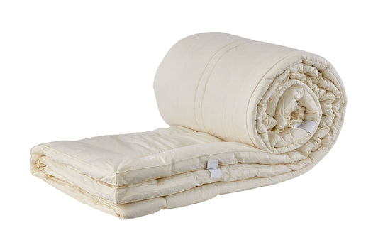 Picture of a Sleep&Beyond myOrganic Mattress Pad that's been partially rolled up.