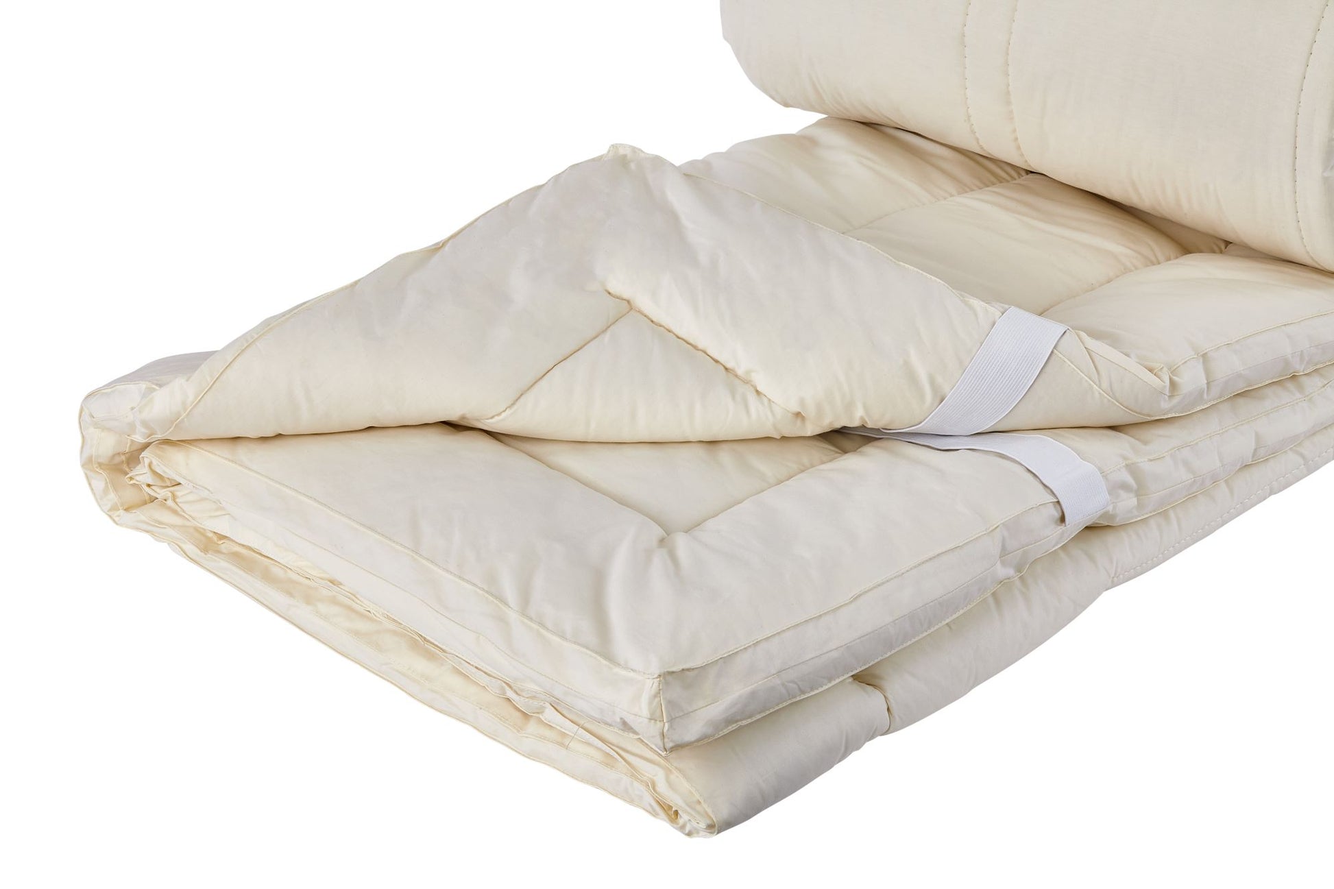 A close up picture of the Sleep&Beyond myOrganic mattress pad showing off the quilted layers of this product.