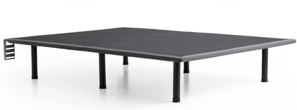 A picture of the Thin Deck Platform Frame with black legs, gray upholstery, and a headboard bracket attached at the head of the bed.